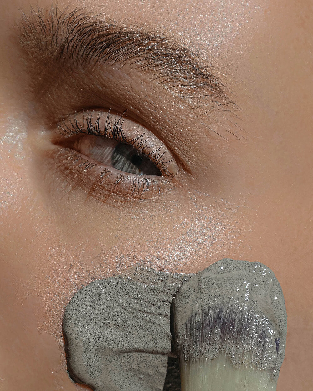woman's face with blue clay | anokha